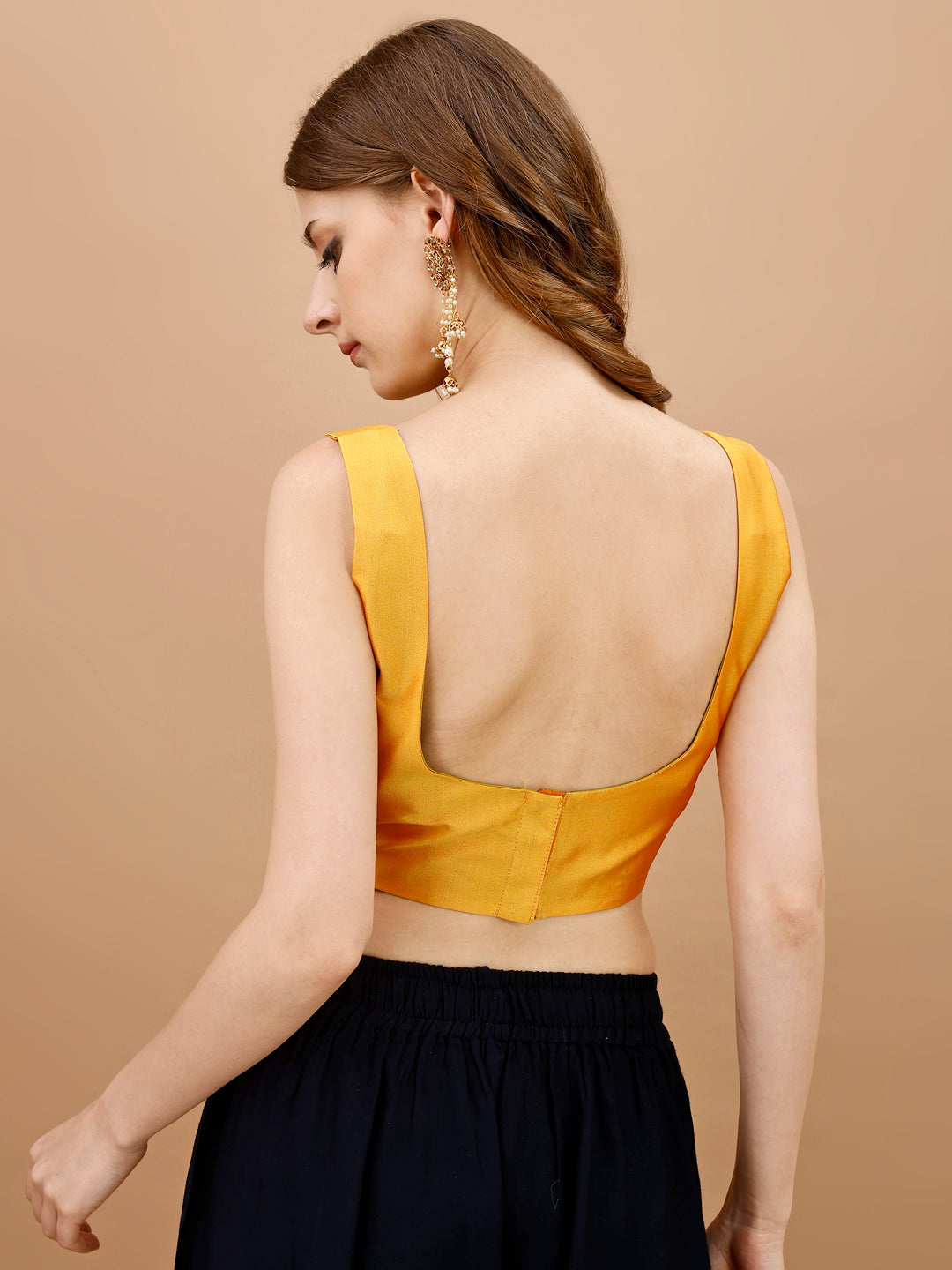 Yellow colored sleeveless tafeta blouse